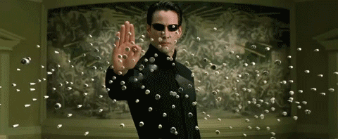 keanu-reeves-neo-stopping-bullets-in-the-matrix-7vhbe6xvbzc4luxo